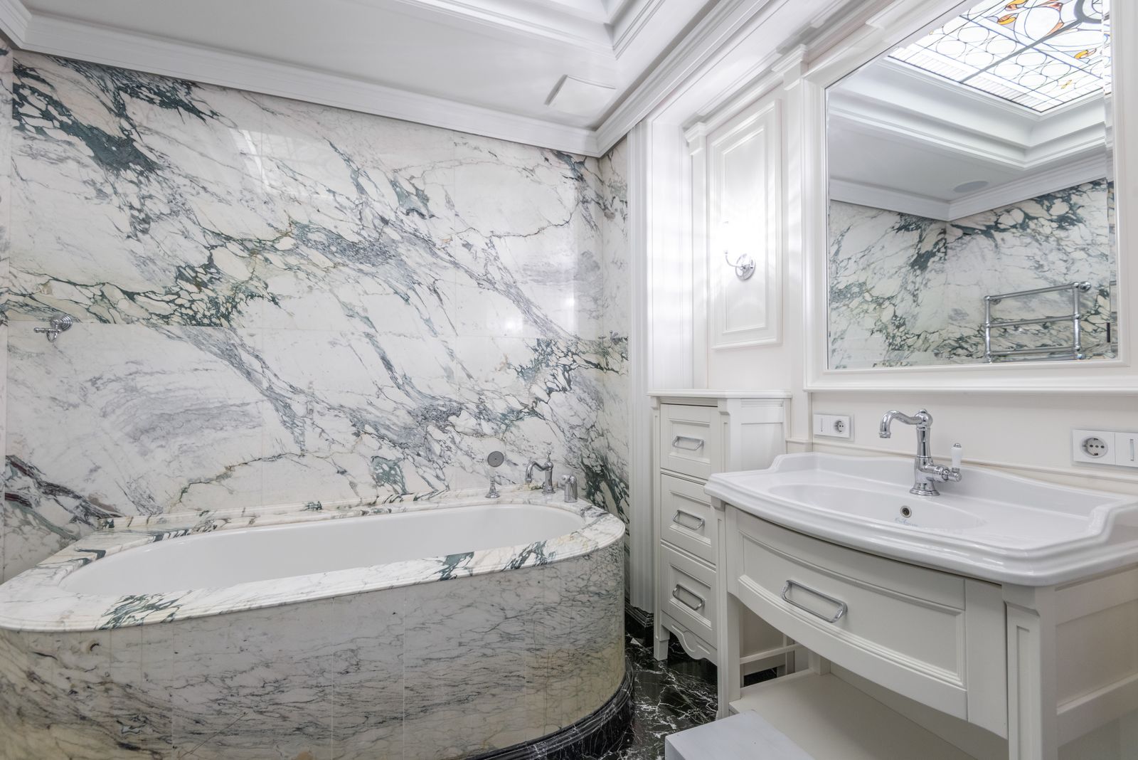 Bright marble bathroom with freestanding tub