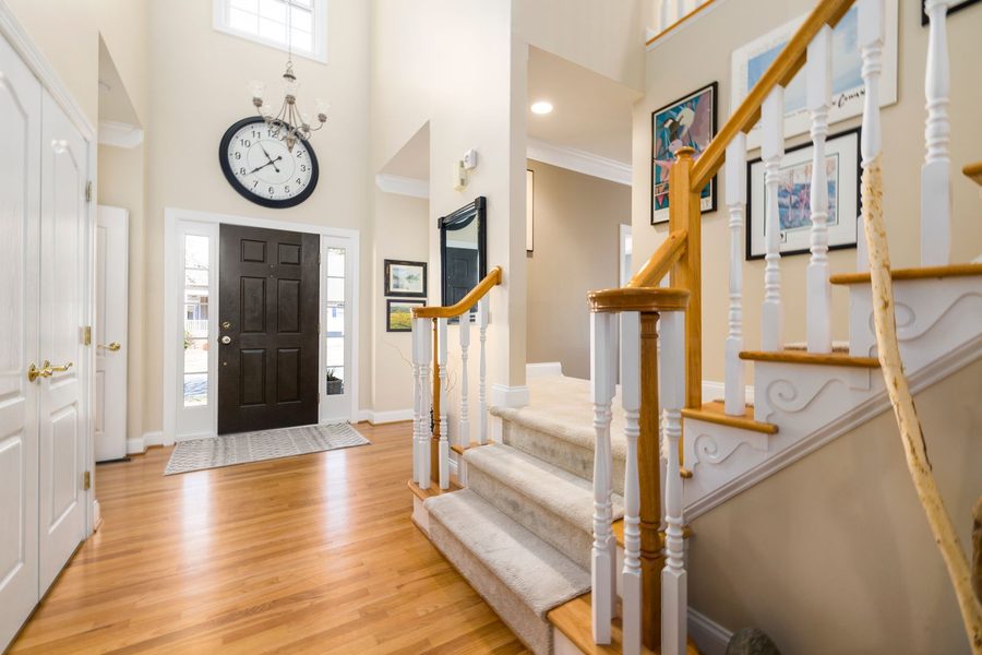 Curved Staircase Entry, interior design by Reynolds Interior Design