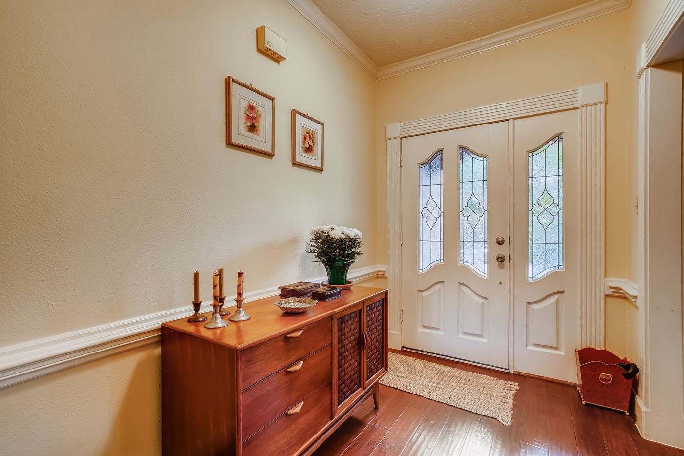 Styled entry console with art and accessories, a detail by Reynolds Interior Design